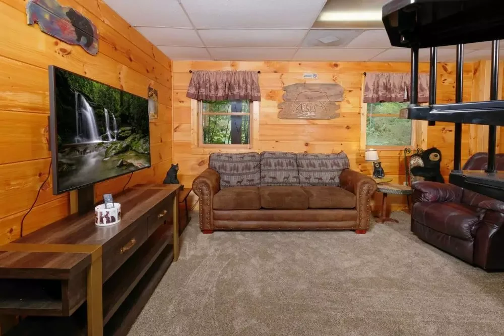 Comfortable family living area with leather seating and a flat-screen TV